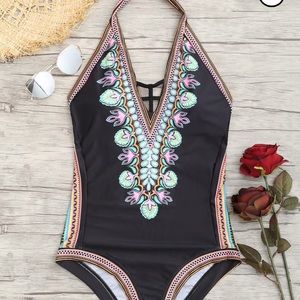 Woman’s black swimsuit